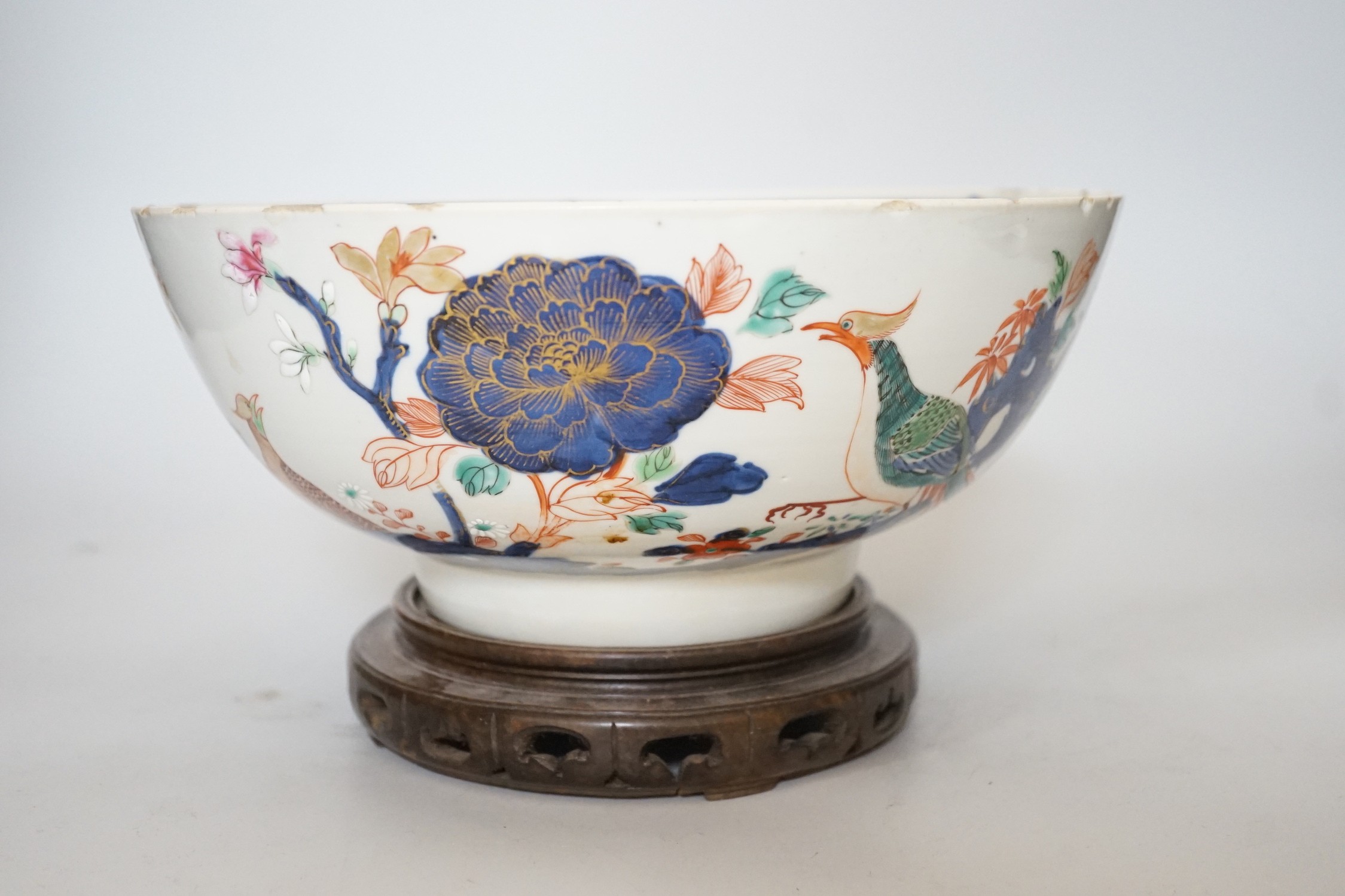 An 18th century Chinese famille rose bowl on wood stand, c.1740, diameter 26cm